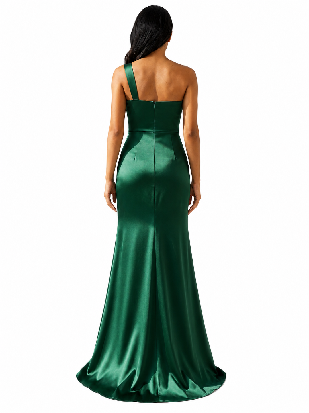 A woman viewed from the back wearing a floor-length emerald green satin gown with a single strap and structured waist, photographed against a plain white background.