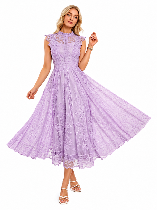 A woman modeling a lavender lace midi dress with a high neck, cap sleeves, and a full flared skirt, paired with white strappy heels against a plain white background.