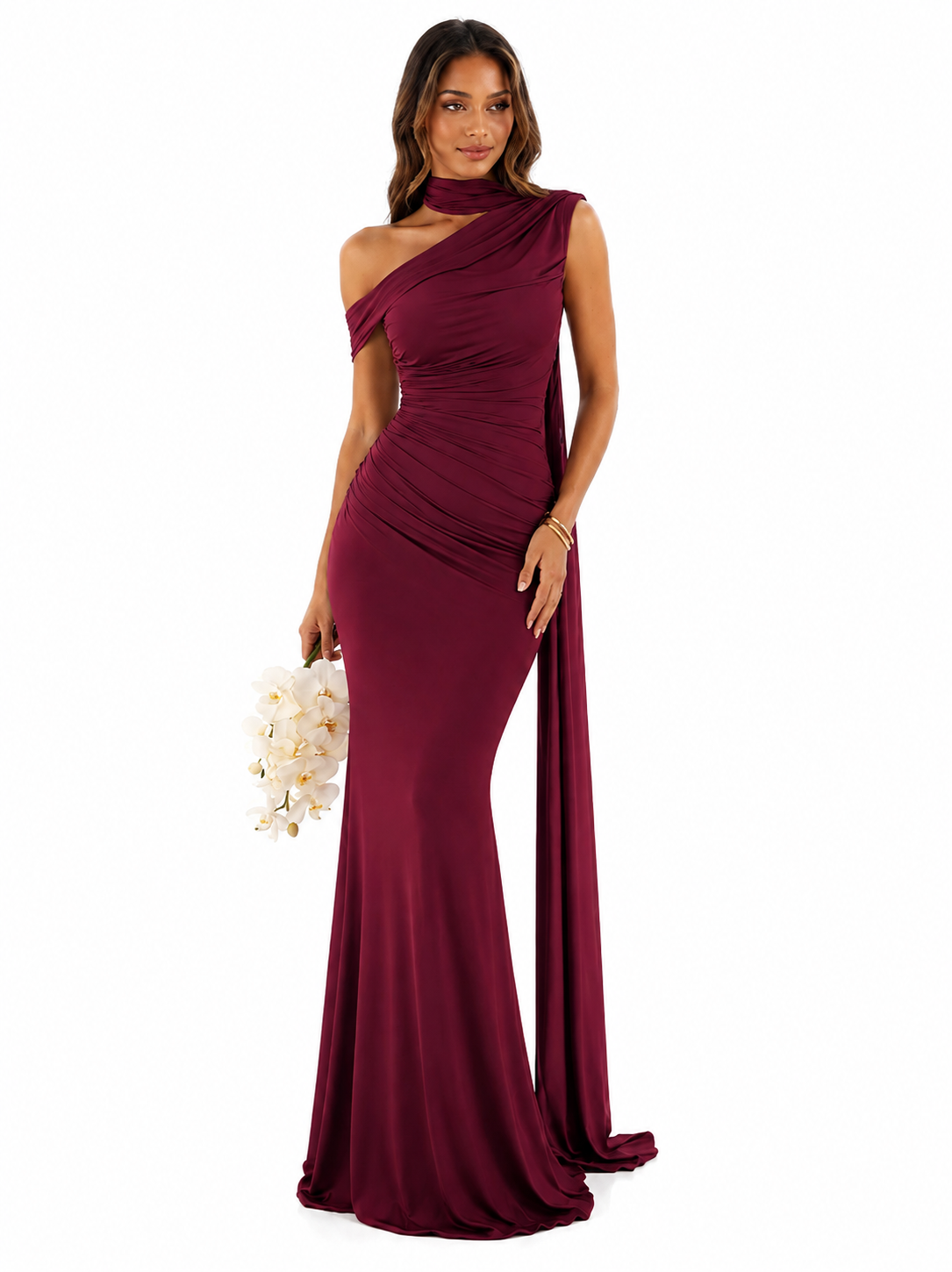A woman modeling a floor-length, one-shoulder mermaid gown in deep burgundy. The dress features a draped choker neckline, a side cutout, and a fitted silhouette with a slight train.